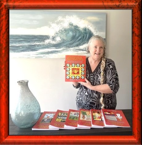 Debbie Dunn holds up Book 1 in front of 7-book spread of Bible books for His Glory
